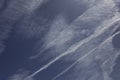 View of blue sky with interesting shapes of clouds and lines