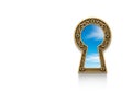 A view of the blue sky through an old keyhole. Space for text. Royalty Free Stock Photo