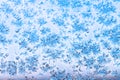 View of blue sky through snowflakes and frost Royalty Free Stock Photo