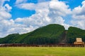 View of blue sky, white clouds and green hills and forest at outdoor reservoir Royalty Free Stock Photo