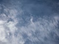 View of blue sky with white clouds in a sunny day. Background of sky with patchy clouds Royalty Free Stock Photo