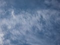 View of blue sky with white clouds in a sunny day. Background of sky with patchy clouds Royalty Free Stock Photo