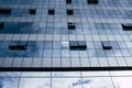 View of blue windows in a skyscraper modern offices building -  concept of people at work at life - openand close windows with sky Royalty Free Stock Photo