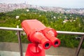 View of the blurred city and sea coast from the red binocular Royalty Free Stock Photo