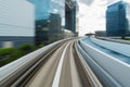 View of blurred downtown district from a moving train. Abstract building background Royalty Free Stock Photo