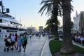 A view of the boardwalk along the beautiful historical town of Trogir, Croatia at sundown, full of beautiful old buildings Royalty Free Stock Photo