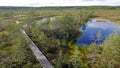 View on a boardwalk in the Viru bog in the Lahemaa National Park in Estonia. There is an observation tower in the middle of it. Royalty Free Stock Photo