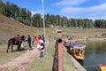 view from the boat of Indian tourists by the coast of Sanasar lake Royalty Free Stock Photo