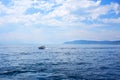 View of a boat in motion on water. Lake Baikal on a summer day. Listvyanka village. Royalty Free Stock Photo