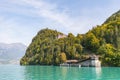 View from a boat over the turquoise lake Brienz to grand hotel g