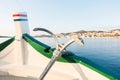 View of boat, ship bow with traditional anchor, mediterranean old historic city in background Royalty Free Stock Photo