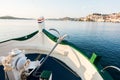 View of boat, ship bow with traditional anchor, mediterranean old historic city in background Royalty Free Stock Photo