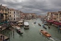 The view of boat traffic using the  Grand Canal, which is the main waterway of Venice that divides the city in two, on a cloudy Royalty Free Stock Photo