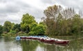 View of a boating lake with row and paddle boats parked, Battersea Park, London, United Kingdom Royalty Free Stock Photo