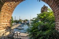 View of boats in the port, seagull in the foreground, framed through an arch, Nesebar, Bulgaria