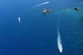 Boats sailing on the sea, around the rocks Royalty Free Stock Photo