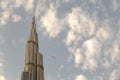 View of a Boing airplane flying close to Burj Khalifa in Dubai Royalty Free Stock Photo