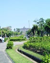 the view of Borobudur temple from a distance there are tourists going to visit