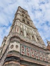 View from bottom of cathedral of Santa Maria del Fiore, florence Firenze, italy with blue sky and clouds, travel concept Royalty Free Stock Photo