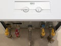 View from the bottom at gas fired boiler heater with lot of taps and pipe Royalty Free Stock Photo