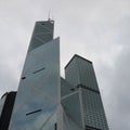 View from the bottom up of skyscraper on the background blue sky Hong Kong, office building, day. City Business District Royalty Free Stock Photo