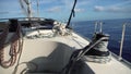 View from bow of moving yacht with ropes and winches