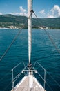 View from a bow of sailing yacht to the sea and mountains Royalty Free Stock Photo