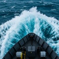 View from the bow of a ship slicing through the ocean, creating dynamic white waves Royalty Free Stock Photo