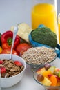 View of bowl of cereals, fruit salad and food