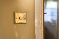 view of a brass light switch and dimmer seen recently installed into a period house Royalty Free Stock Photo