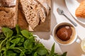 View of bread, basil and cup