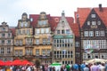 View of Bremen market square with Town Hall, Roland statue and crowd of people, historical center, Germany