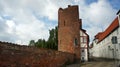 View of the brick wall and Halbturm-Haus, a half-timbered house at the street An der Mauer, beautiful architecture, Lubeck, Royalty Free Stock Photo