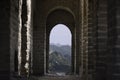 View through a brick window of a Fortress Guard Tower of Mutianyu, a section of the Great Wall of China during summer Royalty Free Stock Photo