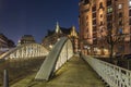 View of the bridge and the brick building in Hamburg, night illumination