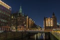 View of the bridge and the brick building in Hamburg, night illumination