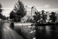 Amsterdam, Holland, the Netherlands - July 6 2020: capture of the typical Amsterdam scenery at a water crossing of a canal staging