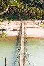 View of the bridge over the river Nam Khan river, Louangphabang, Laos. Copy space for text. Vertical. Royalty Free Stock Photo