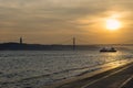 View of the bridge over the Tagus River in Lisbon, at sunset Royalty Free Stock Photo