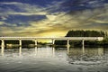 View of a bridge passing over the river Sutlej at Sunset time in rural Punjab, India.