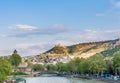 View from the Bridge of Peace in Tbilisi, a pedestrian bridge over the Mtkvari River in Tbilisi. Tabor Monastery of the