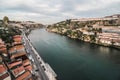 view at bridge Ponte do Infante on Douro river in Porto. Landscape with river and Vila Nova de Gaia city on the hilly shore Royalty Free Stock Photo