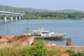 View of the bridge, river, boat and palm grove