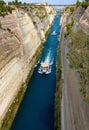 View from the bridge to the boats and View from the bridge to the boats and yachts passing through the Corinth Canal from a sunny