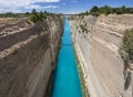 View from the bridge to the boats and yachts passing through the Corinth Canal from a sunny day on Peloponnese in Greece