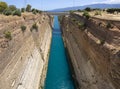 View from the bridge to the boats and yachts passing through the Corinth Canal from a sunny day on Peloponnese in Greece