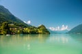 View of Brienz lake with clear turquoise water. Traditional wooden houses on the shore of Brienz lake in the village of Royalty Free Stock Photo