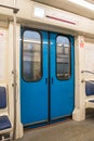 Contemporary inside space of the underground railway carriage with empty seats. Royalty Free Stock Photo