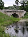 Old stone bridge, pond in summer park, Gatchina, Russia Royalty Free Stock Photo