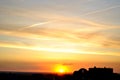 View of a bright summer sunset and clouds over the city's residential areas